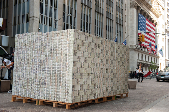 Stacks of dollar bills representing bureaucratic overhead